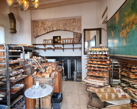 interior of a bakery with trays of pastries